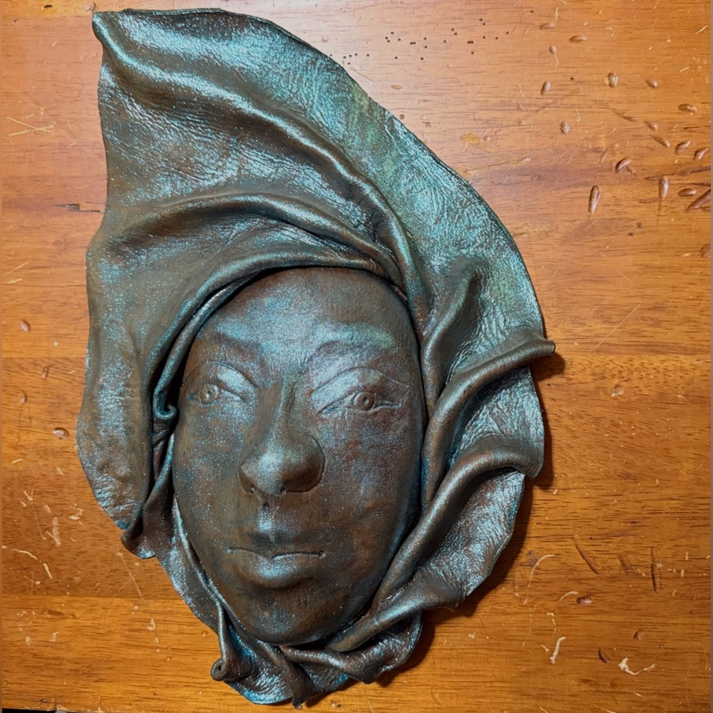 Handcrafted Leather Face mask with headwrap,showing a unique artistic style.